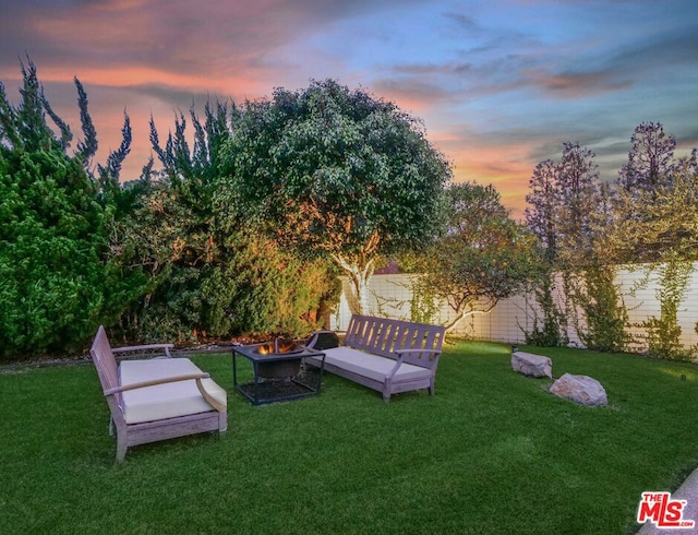 view of yard at dusk