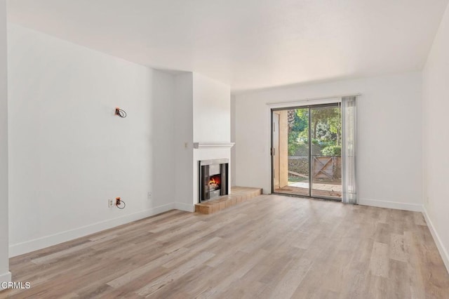 unfurnished living room with light hardwood / wood-style floors