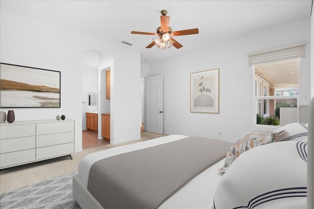 bedroom with connected bathroom and ceiling fan