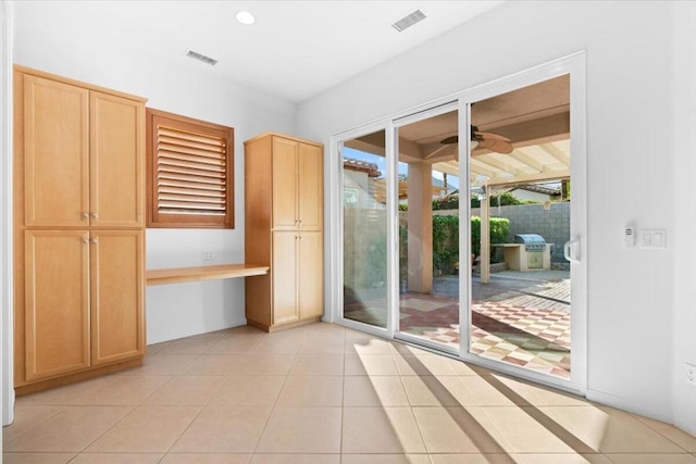 doorway featuring light tile patterned floors