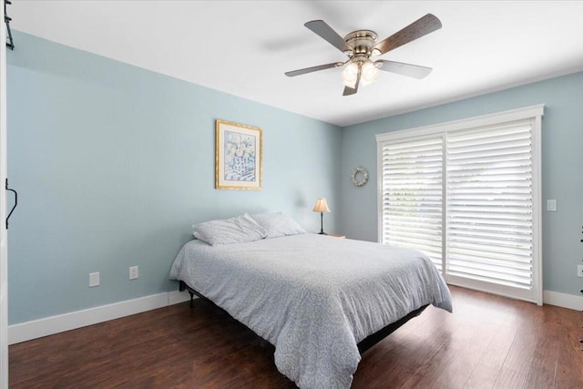 bedroom featuring ceiling fan and dark hardwood / wood-style floors