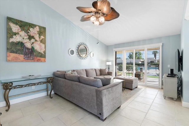 tiled living room with ceiling fan and lofted ceiling