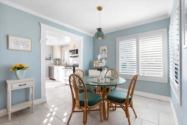 tiled dining room featuring ornate columns and crown molding