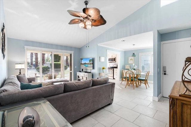 living room with ceiling fan, light tile patterned floors, and high vaulted ceiling