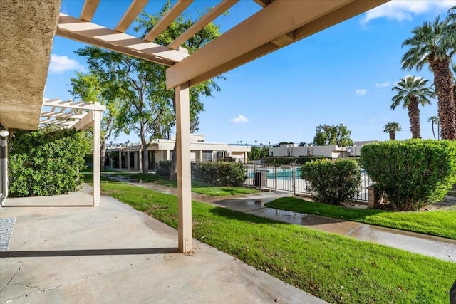 view of patio featuring a pergola and a community pool