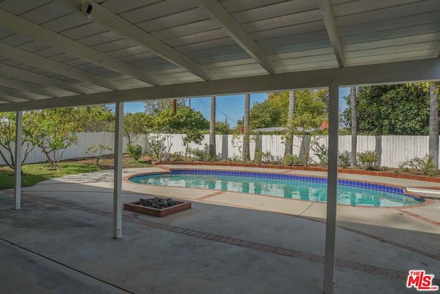 view of swimming pool featuring a patio