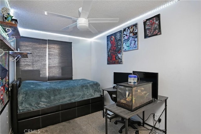 carpeted bedroom featuring a textured ceiling and ceiling fan