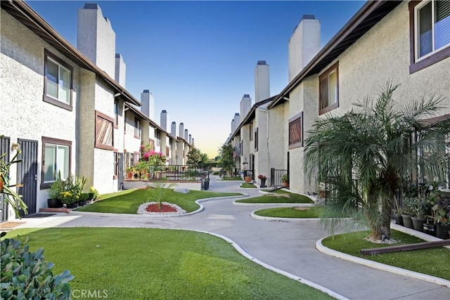 view of home's community featuring a yard