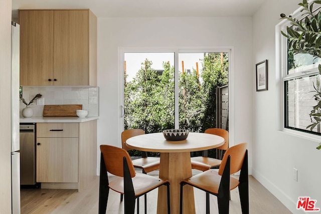 dining room with light wood-type flooring