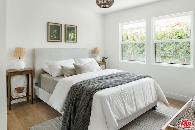 bedroom with light hardwood / wood-style floors