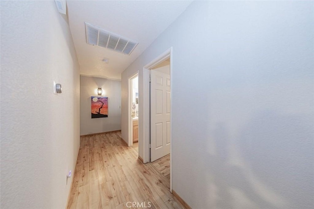 hallway featuring light hardwood / wood-style flooring