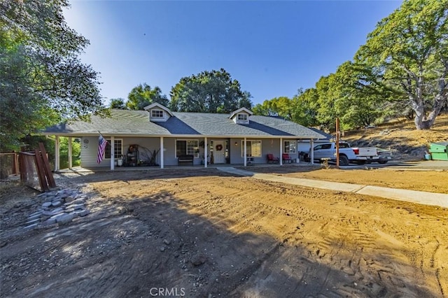 ranch-style home featuring a porch