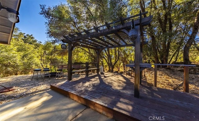 wooden deck featuring a pergola