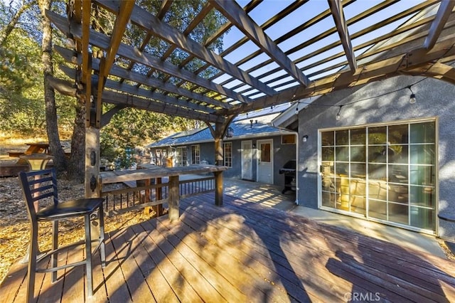 wooden terrace with a pergola