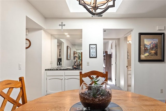 dining room featuring a notable chandelier