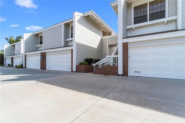 view of side of home with a garage