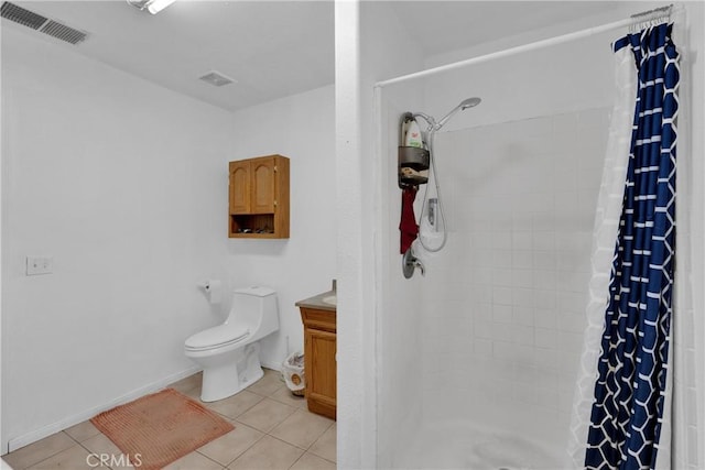 bathroom featuring curtained shower, tile patterned floors, vanity, and toilet