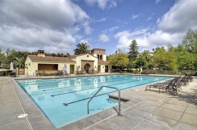 view of pool with a patio area and an outdoor fireplace