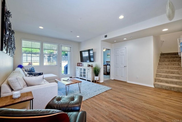 living room with light hardwood / wood-style flooring