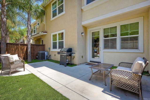 view of patio with area for grilling and cooling unit