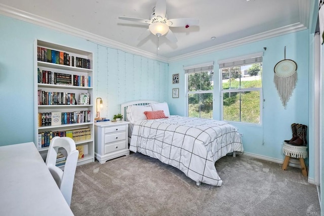 carpeted bedroom featuring ceiling fan and ornamental molding