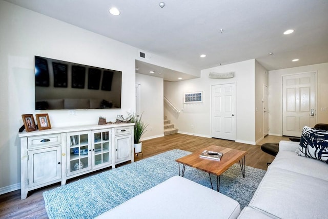 living room with dark hardwood / wood-style flooring