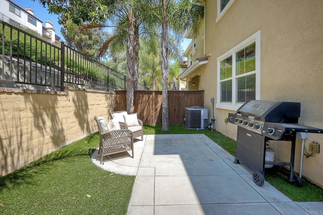 view of patio / terrace featuring central AC and a grill