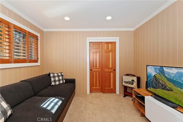 carpeted living room with ornamental molding