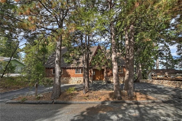 view of property hidden behind natural elements