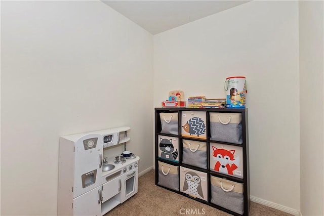 game room with light carpet