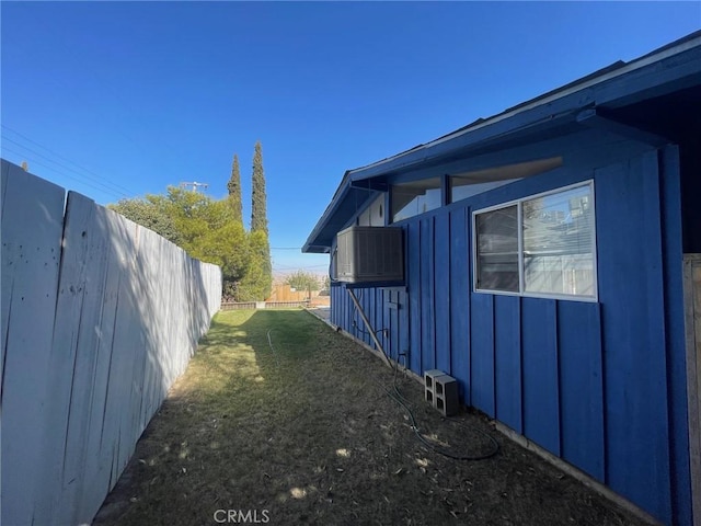 view of property exterior with a yard