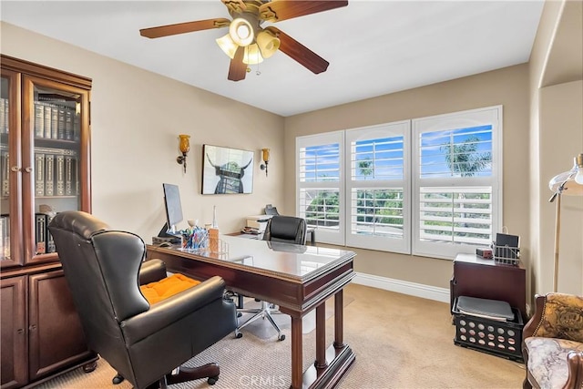 office space with light colored carpet and ceiling fan