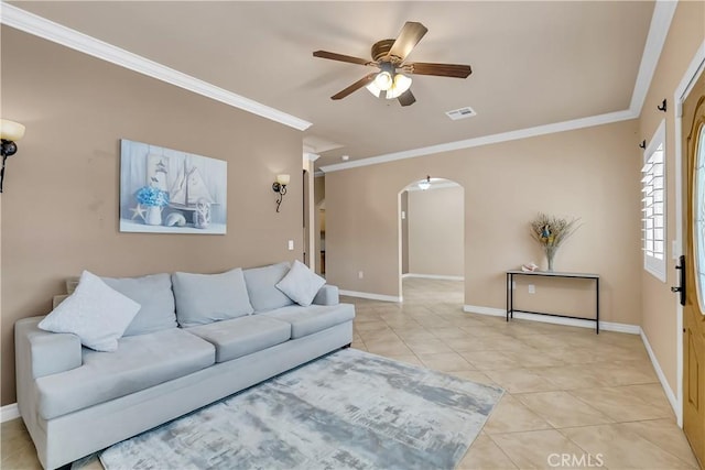 living room featuring ceiling fan, crown molding, and light tile patterned floors