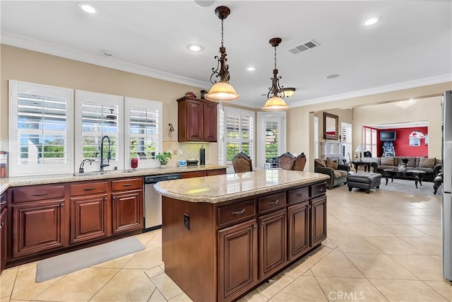 kitchen featuring stainless steel appliances, crown molding, sink, pendant lighting, and light tile patterned floors