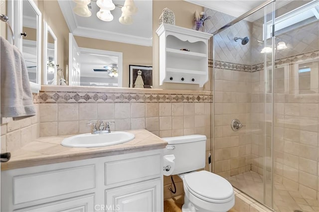 bathroom with walk in shower, vanity, crown molding, tile walls, and toilet