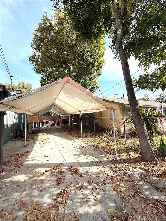 back of property with a carport