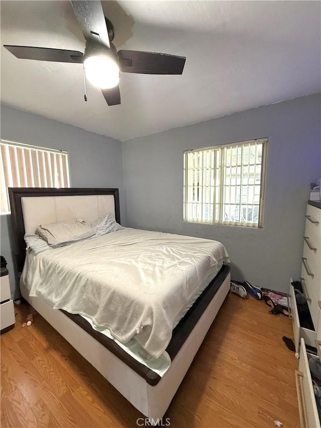 bedroom featuring ceiling fan and wood-type flooring