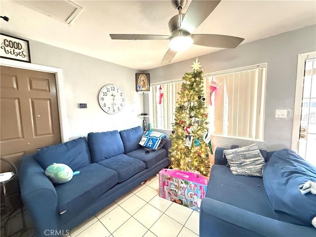 living room with ceiling fan and light tile patterned floors