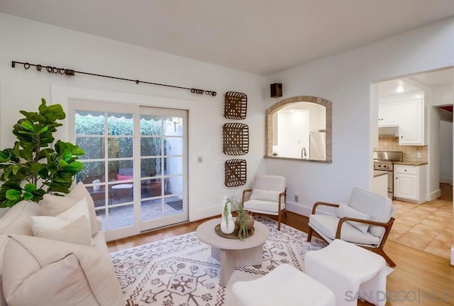 sitting room featuring light hardwood / wood-style flooring