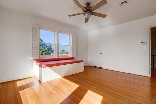 unfurnished room featuring hardwood / wood-style flooring and ceiling fan