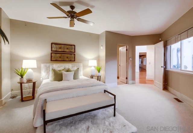 carpeted bedroom with ceiling fan