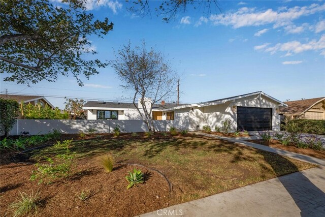 ranch-style home featuring a garage