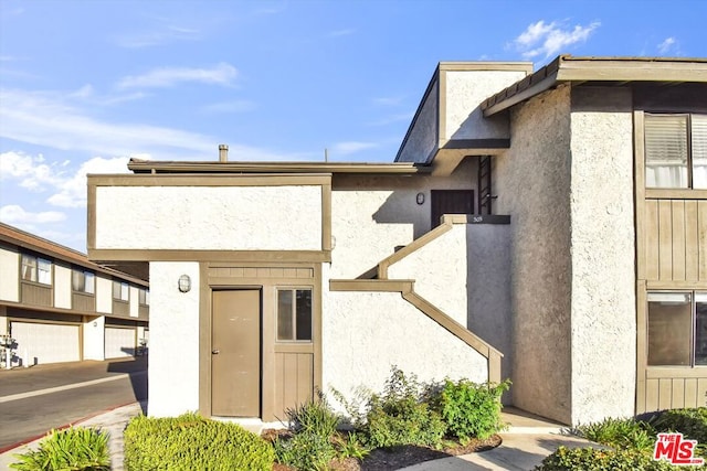 entrance to property featuring a garage