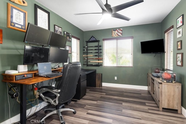 office featuring dark hardwood / wood-style floors and ceiling fan