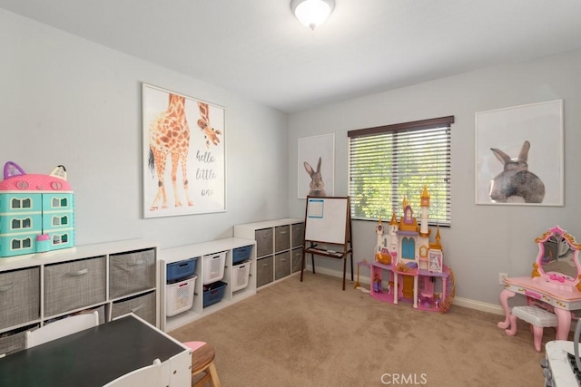 recreation room with light carpet