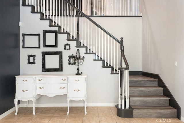 stairs featuring tile patterned flooring