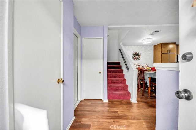 foyer entrance with light hardwood / wood-style flooring