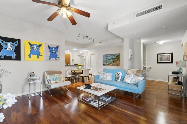 living room featuring ceiling fan, hardwood / wood-style floors, and rail lighting