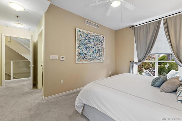 bedroom featuring ceiling fan and light colored carpet