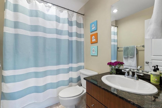 bathroom with curtained shower, tile patterned flooring, vanity, and toilet